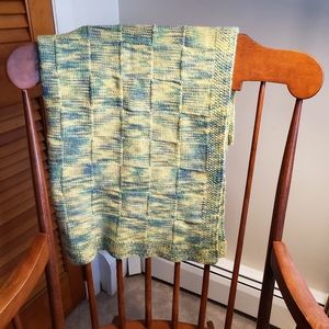 Hand knitted square pattern yellow blue